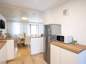Kuchyň nebo kuchyňský kout v ubytování Apartments Nada