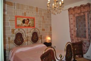 a bedroom with a bed and a brick wall at Casa Regina in Oriago Di Mira