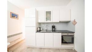 Kuchyň nebo kuchyňský kout v ubytování Apartments Magdalena