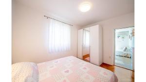 Postel nebo postele na pokoji v ubytování Apartments Magdalena