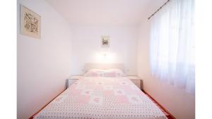 Postel nebo postele na pokoji v ubytování Apartments Magdalena
