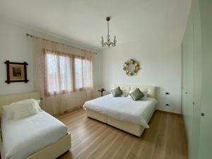 Postel nebo postele na pokoji v ubytování The VIEW Apartment, MURANO island