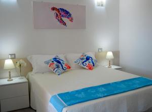 Posteľ alebo postele v izbe v ubytovaní B&B Capo Rizzuto fronte Mare