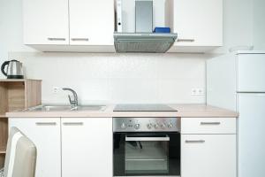 Kuchyň nebo kuchyňský kout v ubytování Apartments Tamaris