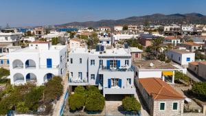 an aerial view of a white house with blue accents at Aeginia 2 in Perdika