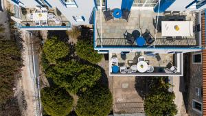 an overhead view of a yard with cars and trees at Aeginia 2 in Perdika