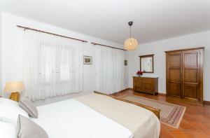 Postel nebo postele na pokoji v ubytování Antares Apartments