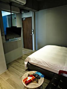 Letto o letti in una camera di 18世紀普魯士藍現代寓所Prussian Blue Inn原愛迪亞旅社