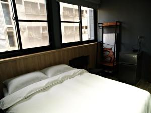 Letto o letti in una camera di 18世紀普魯士藍現代寓所Prussian Blue Inn原愛迪亞旅社