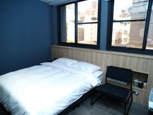 Letto o letti in una camera di 18世紀普魯士藍現代寓所Prussian Blue Inn原愛迪亞旅社