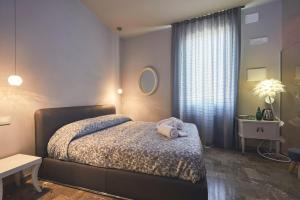 Postel nebo postele na pokoji v ubytování Le Stagioni Luxury Suite