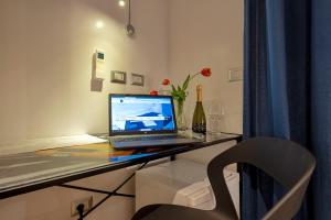 TV a/nebo společenská místnost v ubytování Terre Bianche