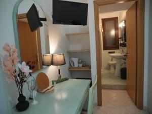 Ένα μπάνιο στο Locanda Lighea Rooms +63 φωτογραφίες