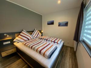 Ένα ή περισσότερα κρεβάτια σε δωμάτιο στο Ferienhaus Sterneneifel