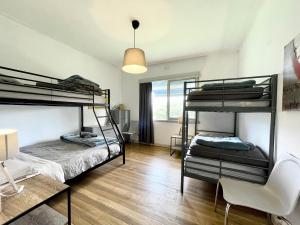Postel nebo postele na pokoji v ubytování Jettycove Beach House