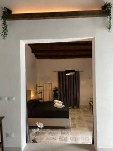 a bedroom with a bed in the middle of a room at La Dimora delle Coste in Comiso