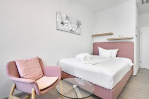 Postel nebo postele na pokoji v ubytování Hotel Ritter Badenweiler