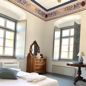 A bed or beds in a room at Villa 1853-Upper floor