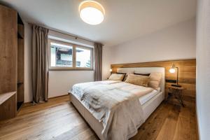 A bed or beds in a room at Studio Alpendomizil Ahorn