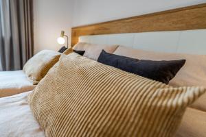 A bed or beds in a room at Studio Alpendomizil Ahorn