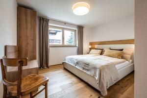 A bed or beds in a room at Studio Alpendomizil Ahorn