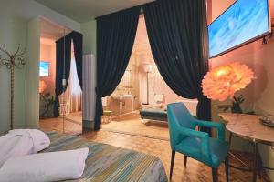 TV a/nebo společenská místnost v ubytování Le Stagioni Luxury Suite