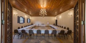 a large room with a long table and chairs at Confraria Colonial Hotel Boutique in Mairinque +88 photos