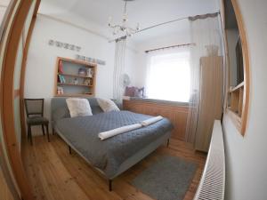 A bed or beds in a room at Bíborlak 7