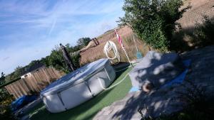 a boat sitting on the side of a yard at Zimmervermietung Bully in Meyenburg