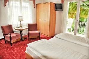 Postel nebo postele na pokoji v ubytování Hotel Zima + 37 fotografií