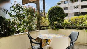 a table and chairs on top of a balcony at Résidence Gray d'Albion Studio ROU503 in Cannes