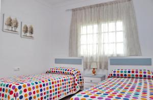 Postel nebo postele na pokoji v ubytování Apartamento Violeta