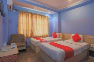 Voodi või voodid majutusasutuse OYO 789 Hotel Shivam Plaza toas