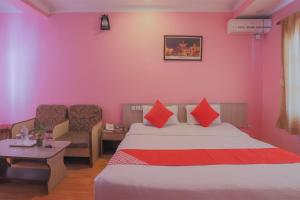 Voodi või voodid majutusasutuse OYO 789 Hotel Shivam Plaza toas