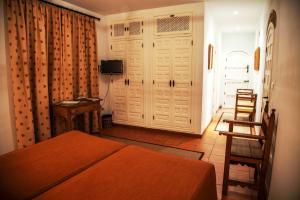 TV a/nebo společenská místnost v ubytování Hotel Boutique Casa de Orellana