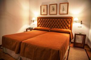 Postel nebo postele na pokoji v ubytování Hotel Boutique Casa de Orellana