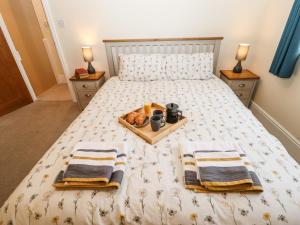 Posteľ alebo postele v izbe v ubytovaní Primrose Cottage