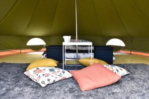 two pillows on a carpet in a tent at BELLTENT SAVICA in Zagreb