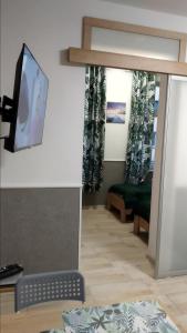 Telewizja i/lub zestaw kina domowego w obiekcie Apartamenty Bulwar Nadmorski, Ustka
