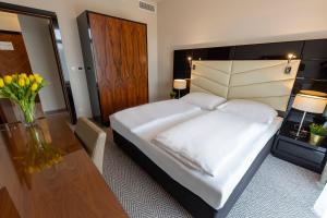 Łóżko lub łóżka w pokoju w obiekcie VacationClub – Diune Resort Apartament 312