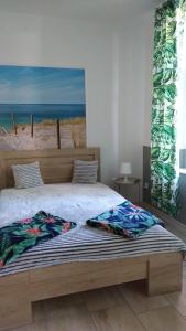 Łóżko lub łóżka w pokoju w obiekcie Apartamenty Bulwar Nadmorski, Ustka