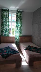 Łóżko lub łóżka w pokoju w obiekcie Apartamenty Bulwar Nadmorski, Ustka