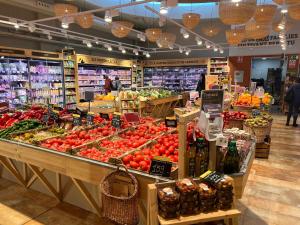 a grocery store filled with lots of fruits and vegetables at Apartaments-Hotel Hispanos 7 Suiza in Barcelona