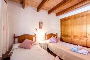 Ein Bett oder Betten in einem Zimmer der Unterkunft Fontxica