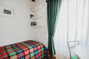 Кровать или кровати в номере La Corte di Costantino-Downtown Como