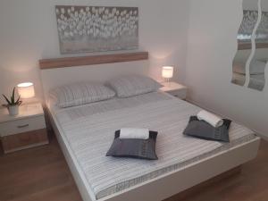 Кровать или кровати в номере Apartment & Rooms Riva