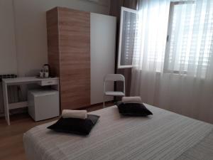 Кровать или кровати в номере Apartment & Rooms Riva