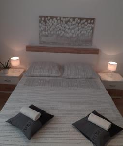 Кровать или кровати в номере Apartment & Rooms Riva