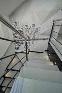 a staircase in a building with a glass ceiling at Marien Haus in Karlovac