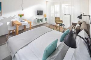 a bedroom with a bed and a living room at WestStrandBlick in Norderney